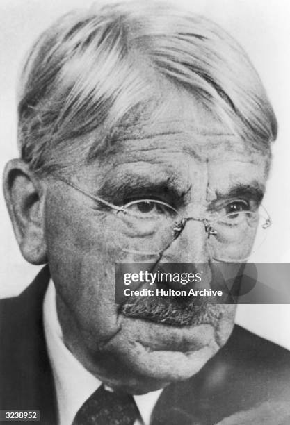 Closeup of American educator and philosopher John Dewey wearing wire-framed glasses. Dewey was a founder of the progressive education movement and...