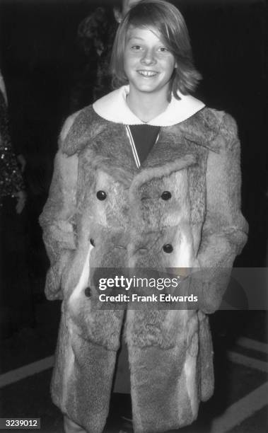 Year-old American actor Jodie Foster smiles while attending the Academy Award Nominations, Los Angeles, California. She wears a fur jacket.