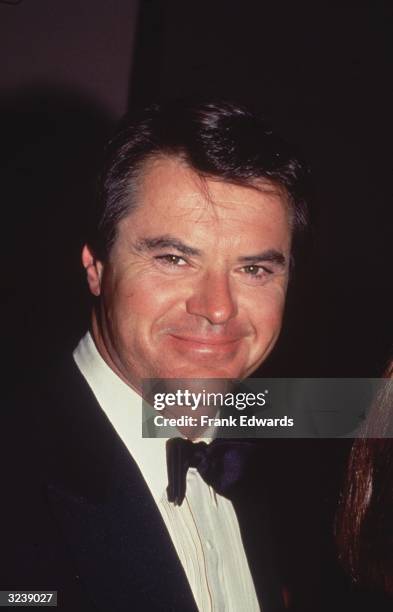Headshot of American actor Robert Urich wearing a tuxedo.