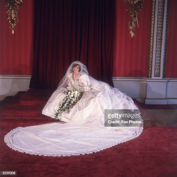 Formal portrait of Lady Diana Spencer in her wedding dress designed by David and Elizabeth Emanuel.