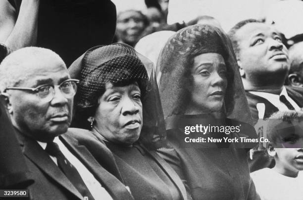 The parents and the widow of assassinated civil rights leader Dr. Martin Luther King Jr. Listen to ceremonies at Morehouse College during a memorial...