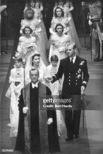 Princess Elizabeth and Prince Philip make their way down the aisle of Westminster Abbey, London, on their wedding day. Original Publication: Picture...