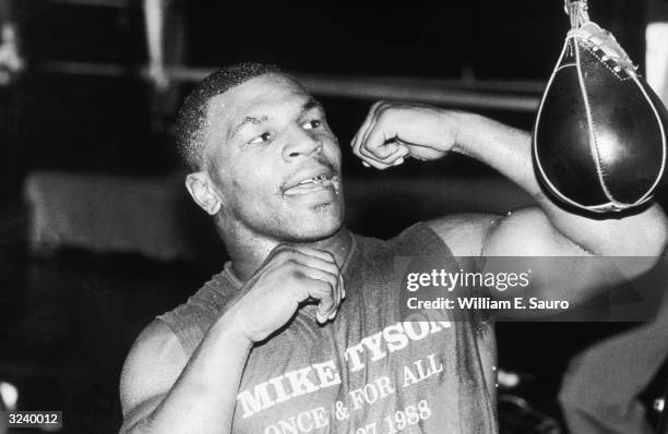 American boxer Mike Tyson trains by hitting a speed bag at Trump Plaza in preparation for his fight with Michael Spinks, Atlantic City, New Jersey.