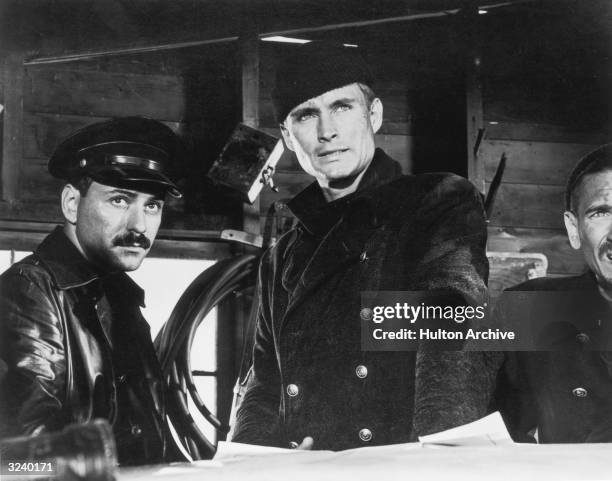 Actors Alan Arkin and John Phillip Law, wearing military garb, look into the distance in a still from the film, 'The Russians Are Coming, The...