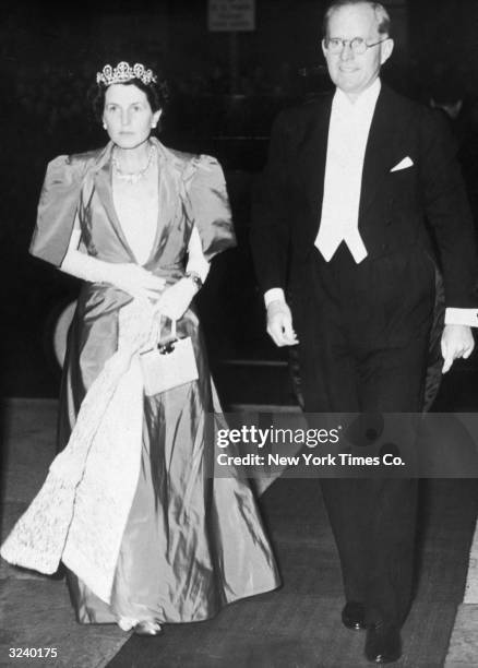 American ambassador to Great Britain, Joseph P Kennedy and his wife, Rose Kennedy , arrive at Covent Garden Opera House, London. Rose wears a satin...