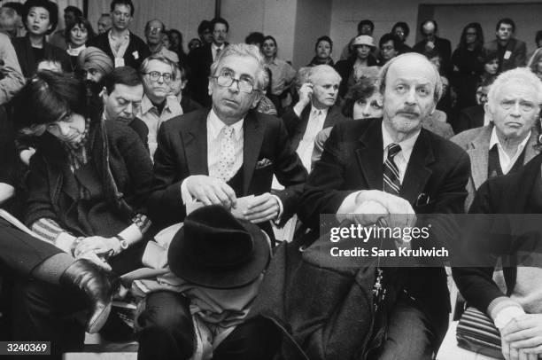From left to right, American authors Susan Sontag, Gay Talese, E L Doctorow and Norman Mailer seated among a group of people at Writers In Support of...
