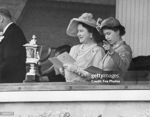 The Queen and Princess Elizabeth studying the form guide on the first day of Ascot.