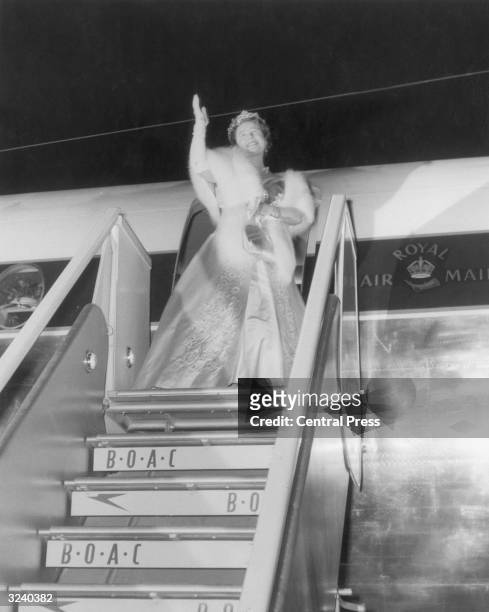 Queen Elizabeth, The Queen Mother , waving goodbye as she leaves Salisbury Airport at the end of her visit to the Federation of Rhodesia and...