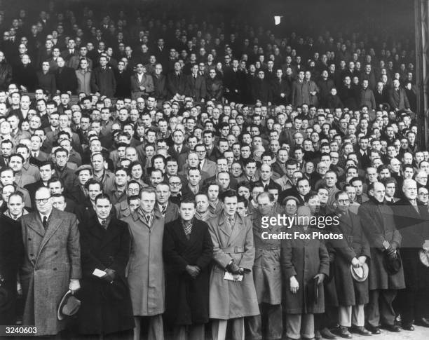 Fulham fans at Craven Cottage marking the death of King George VI with a minute's silence before their match against Newcastle.