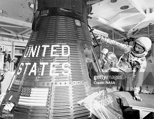 Astronaut John Glenn boards the Friendship 7 capsule to become the first American to orbit the earth, during the MA-6 mission.