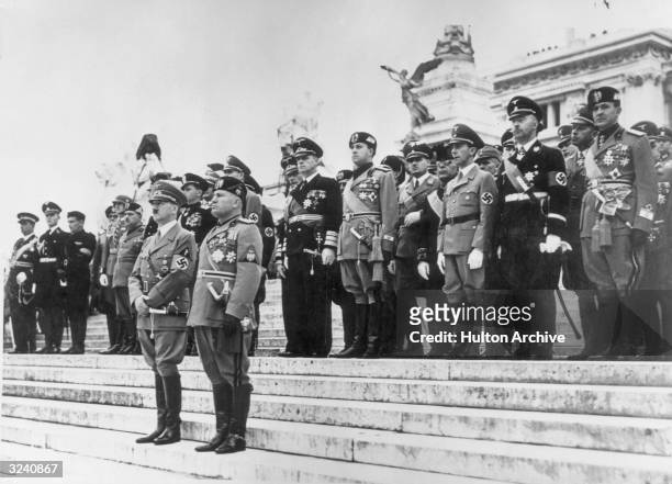 German Fuhrer Adolf Hitler stands next to Italian dictator Benito Mussolini on the steps of the Vittorio Emanuele Monument, Piazza Venezia, Rome,...