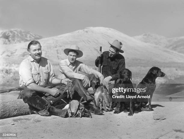Original Publication: From left to right, American writer Ernest Hemingway , American actor Gary Cooper and American hunting and fishing guide Taylor...
