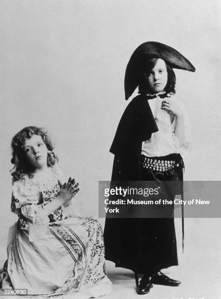 Studio portrait of brother and sister singing and dancing partners Fred Astaire , and Adele Astaire as children, in costume. Fred is dressed as a...