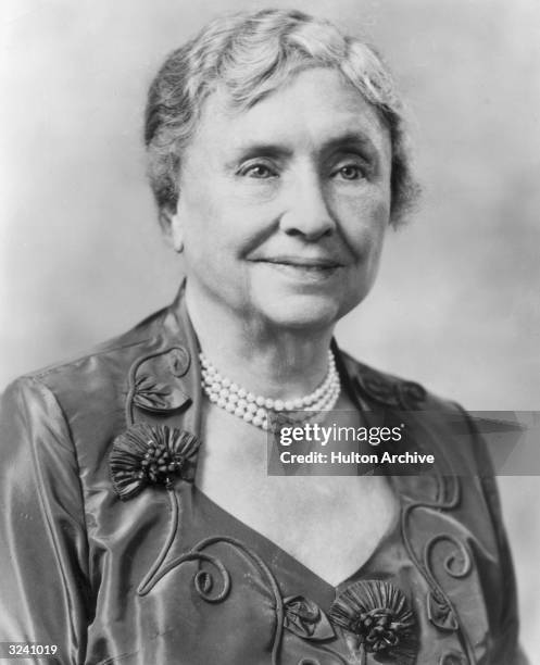 Headshot portrait of American educator and activist for the disabled Helen Keller , wearing a pearl necklace and a dress with a semi-square cut...