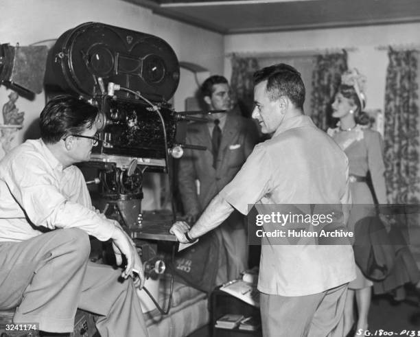 American cinematographer Gregg Toland and French-born director William Wyler talk on the set of Wyler's film, 'The Best Years of Our Lives'. American...