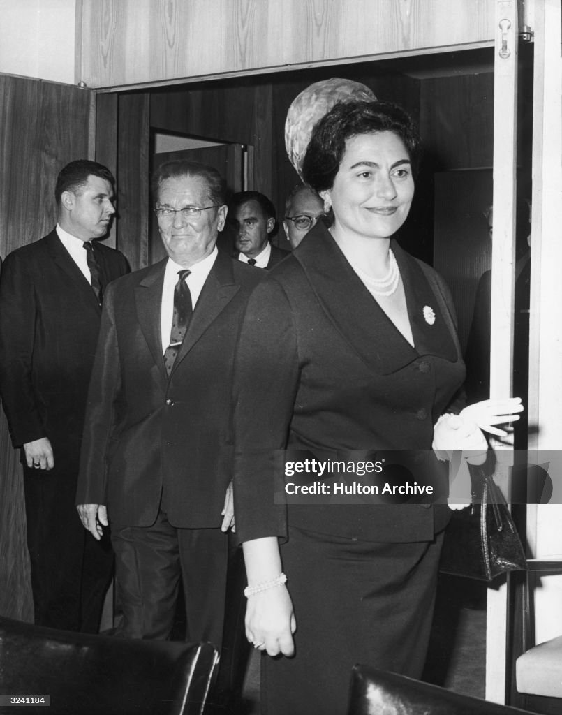 Yugoslav President Josip Broz Tito , smiling towards his wife as he ...