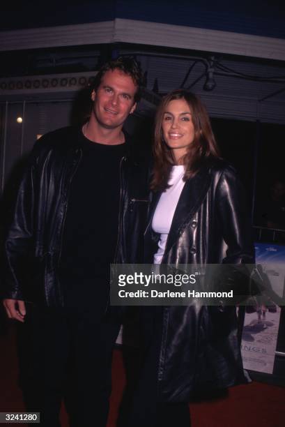 American model Cindy Crawford and her husband, American athlete Rande Gerber, pose at the premiere of director David O Russell's film, 'Three Kings,'...