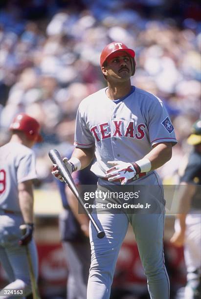 Outfielder Juan Gonzalez of the Texas Rangers in action during a game against the Oakland Athletics at the Oakland Coliseum in Oakland, California....