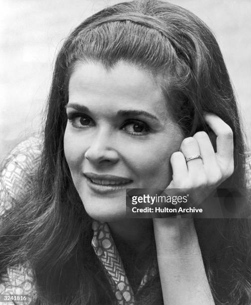 Closeup of American actor Jessica Walter smiling with her hand against her cheek, in a promotional portrait from director John Frankenheimer's film...