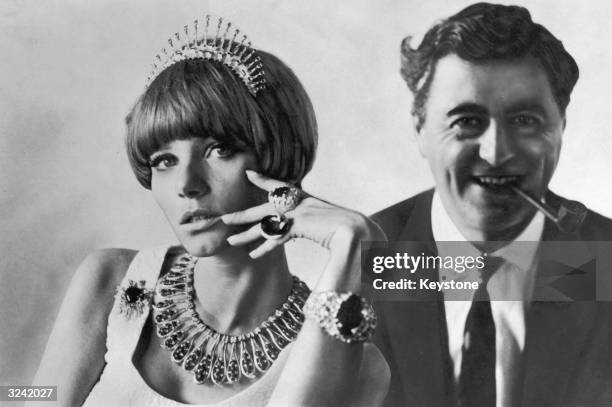 Designer Andrew Grima with a model wearing a selection of his modern jewellery.