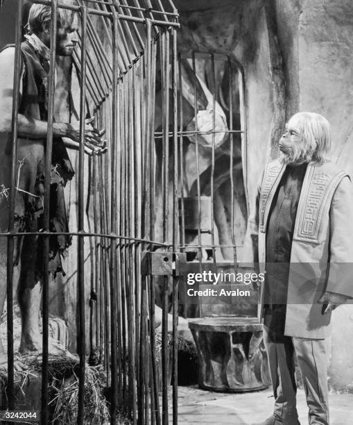 Charlton Heston finds himself the captive of Dr Zaius, played by Maurice Evans in the sci-fi classic 'Planet of the Apes', directed by Franklin J...