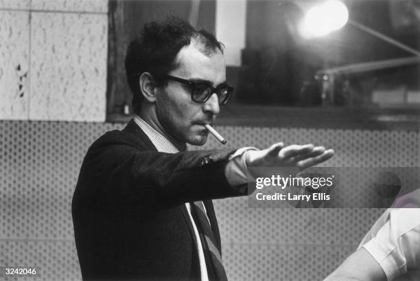 French film director Jean-Luc Godard during the filming of 'Sympathy For the Devil' , featuring the Rolling Stones.