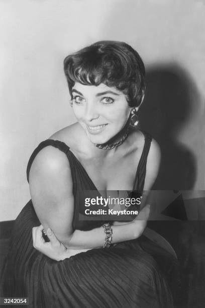 Actress Joan Collins pictured after her arrival back in London from Hollywood; following her arrival she announced that she was seeking a divorce...