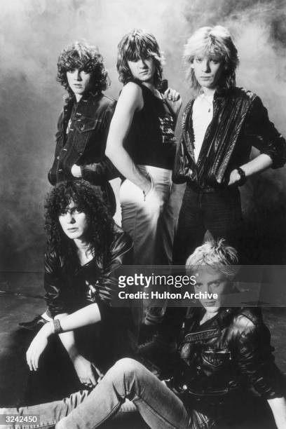 Studio portrait of the British rock group Def Leppard. Clockwise from top left: Bassist Rick Savage, lead singer Joe Elliot, guitarist Steve Clark,...