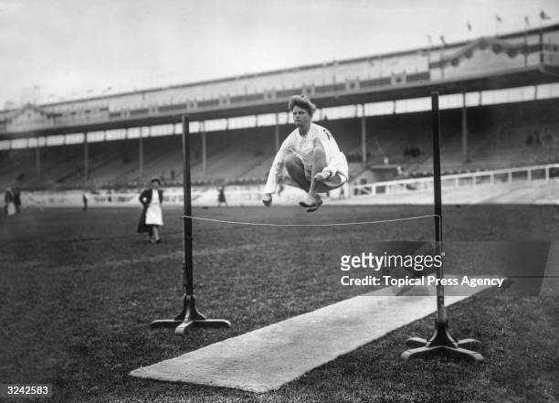 Danish gymnast demonstrating a strange technique at the high jump during the 1908 London Olympics.