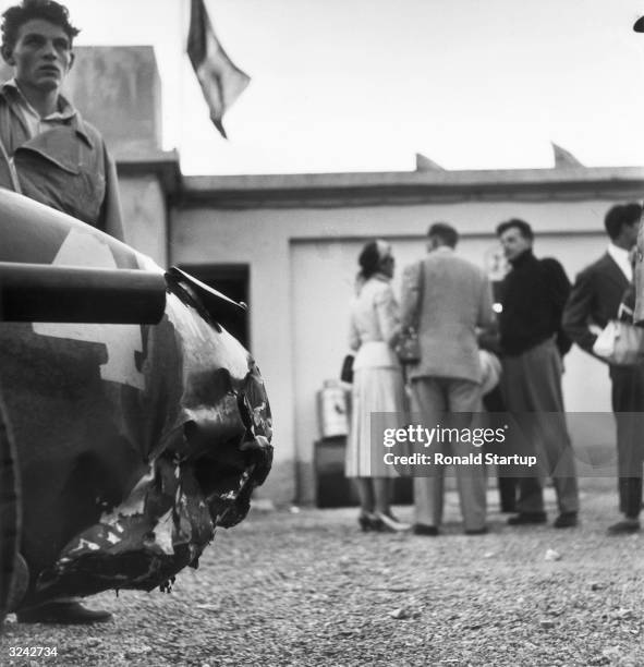 The damaged tail of Alberto Ascari's Ferrari after an incident with his team mate Giuseppe Farina forced him off the track at the last corner of the...