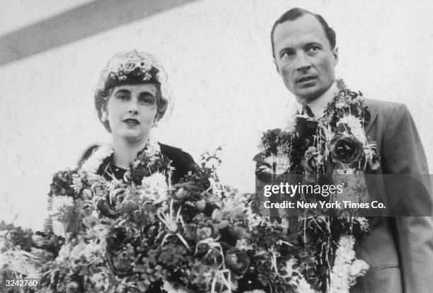 American heiress Barbara Hutton , the Countess von Haugwitz-Reventlow, and her husband, Count Kurt von Haugwitz-Reventlow, arrive in Bombay, India....