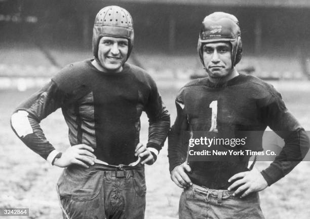 Portrait of football legend Harold 'Red' Grange , captain of the Chicago Bears, and Benny Friedman, captain of the New York Giants.