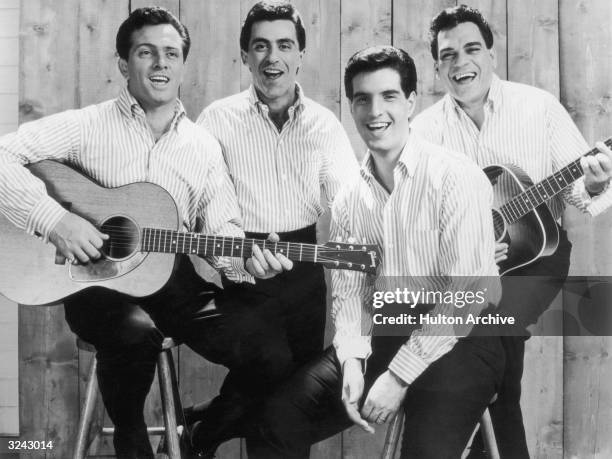 Promotional portrait of the American pop group The Four Seasons. From left: Tommy DeVito , Frankie Vali, Bob Gaudio, and Nick Massi. The band members...