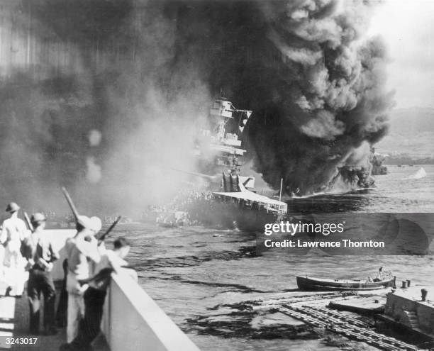 The USS California burns after it was attacked with torpedoes by the Japanese during World War II, Pearl Harbor, Hawaii.