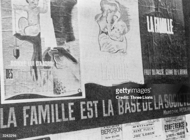 Vichy propaganda posters cover this wall; they promote the 'family' and read, 'The Family, Fruit of the Past, Seed of the Future' and 'The Family is...