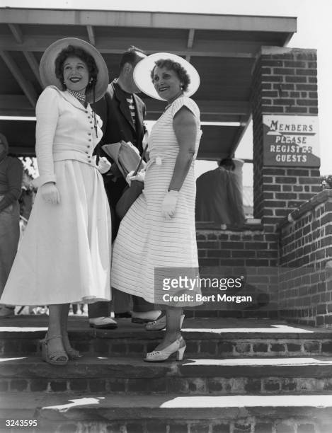 Jolie Gabor, right , and her daughter, Magda Gabor , pose on a staircase in sun hats and white gloves, Southhampton, New York, 1950s. Jolie Gabor is...