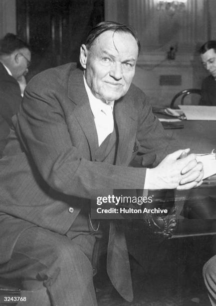 American lawyer Clarence Darrow sits at a desk at the House Judiciary Committee, Washington, D.C.