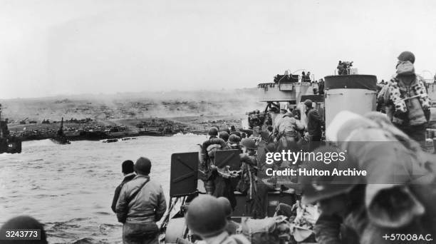 Carrying troops and ground personnel of the 7th Fighter Command make a run for the beach during the battle for Iwo Jima, World War II, Japan. The...