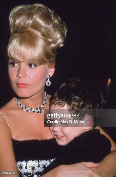 American actor Sandra Dee and her son, Dodd, at the Cocoanut Grove nightclub on her husband Bobby Darin's opening night, Los Angeles, California.