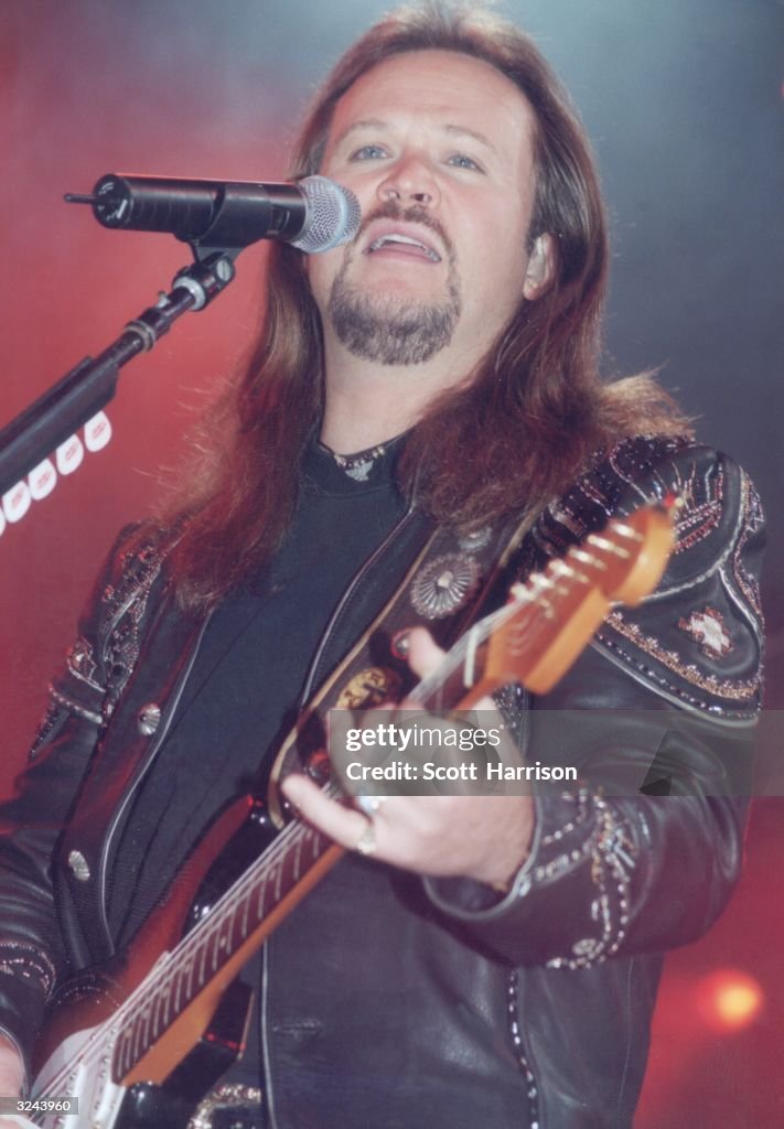 Tritt American country singer Travis Tritt performing onstage with an... News ...