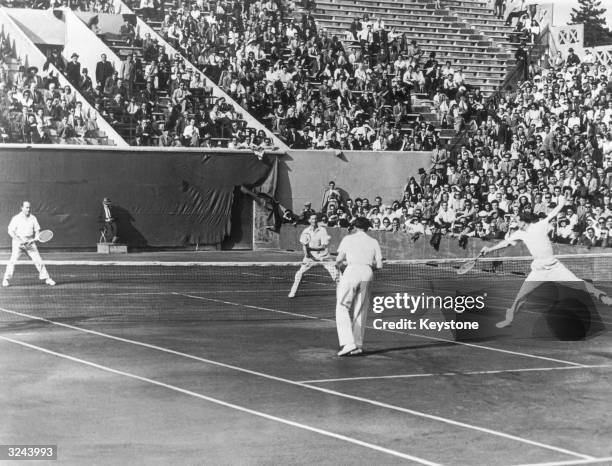 Frenchmen Marcel Bernard and Bernard Destremau beat British pair John Oliff and Henry Billington in a Davis Cup tie match at the Roland Garros courts...