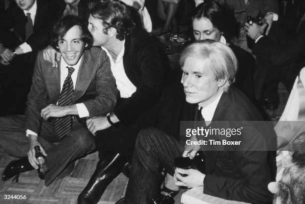 Steve Rubell, co-owner of the nightclub Studio 54, and artist Andy Warhol watch the Academy Awards during an Oscars party at Studio 54, New York City.