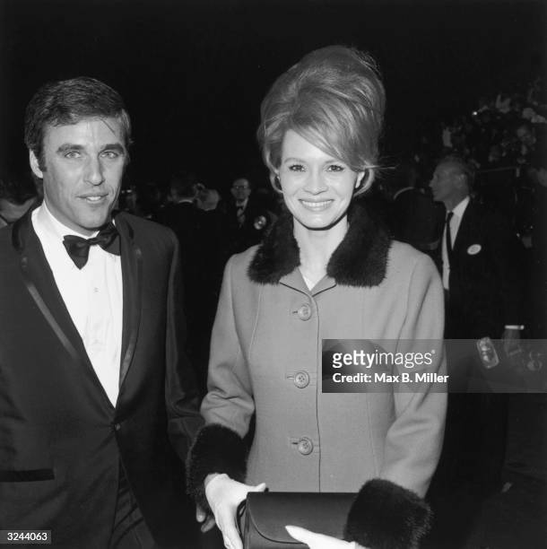 American actor Angie Dickinson with her husband, American composer Burt Bacharach, wearing a tuxedo, at the Academy Awards, Los Angeles, California.