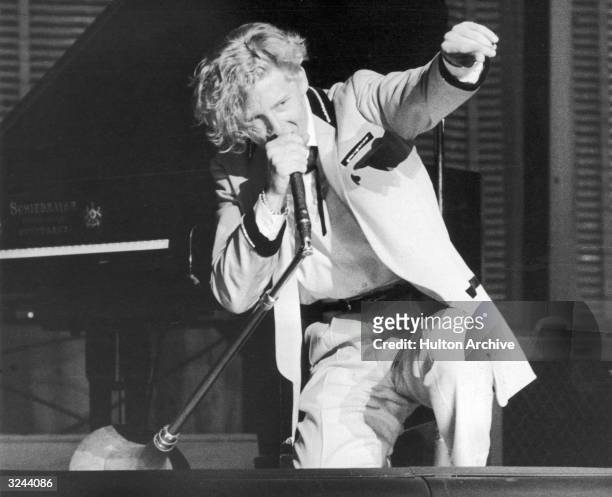 American rock n' roll singer and pianist Jerry Lee Lewis performing in concert in England.