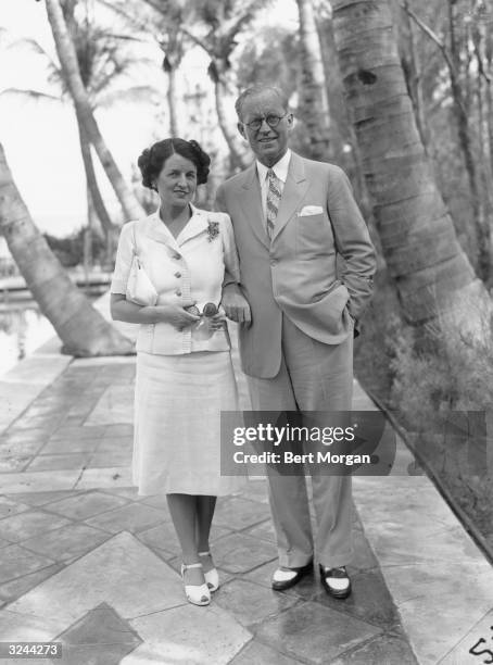 American financier and ambassador Joseph P Kennedy and his wife, Rose Kennedy , linking arms and strolling along stone path in Palm Beach, Florida.
