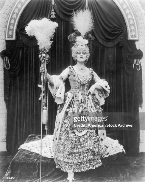 American actor Theda Bara poses in costume as Madame Du Barry in a promotional portrait from director J Gordon Edwards's film, 'Madame Du Barry'.