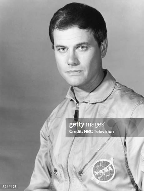 Promotional studio portrait of American actor Larry Hagman wearing his uniform as NASA astronaut Major Tony Nelson from the television series, 'I...