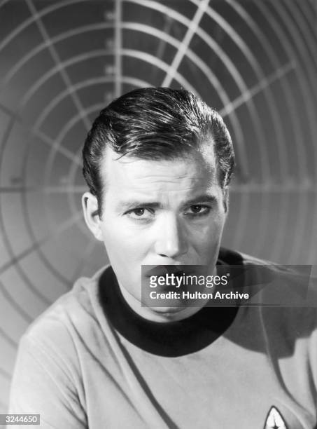 Canadian-born actor William Shatner wears a starship uniform as Captain James T Kirk in a promotional portrait for the science fiction television...