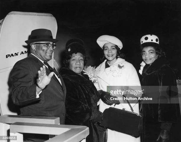 Relatives of Reverend Martin Luther King Jr. Board an airplane to attend the social reformer's Nobel Peace Prize presentation ceremony, JFK...