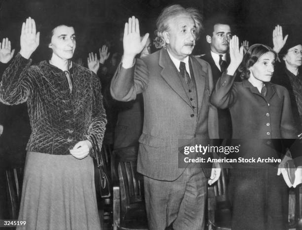 German-born physicist Albert Einstein , his secretary Helen Dukas, left, and his daughter Margaret Einstein take the oath of U.S. Citizenship.